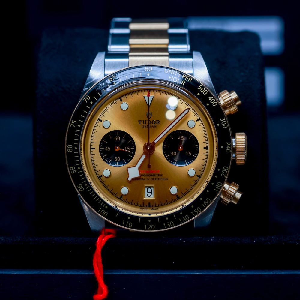 Tudor Black Bay Chrono original box and papers watch with gold and steel design, chronograph feature, and original tag.