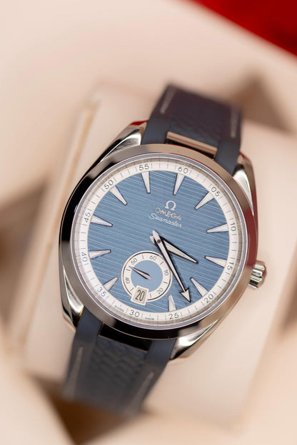 Omega Seamaster Aqua Terra 150M blue dial on a blue rubber strap with small seconds subdial.