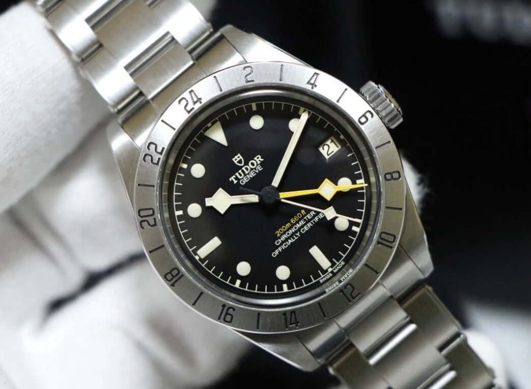 Tudor Black Bay Pro review watch with black dial and yellow GMT hand on stainless steel bracelet