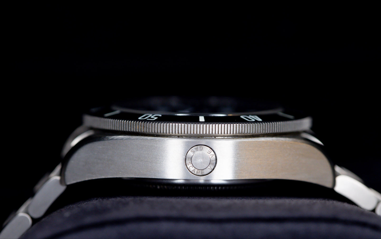 Tudor Pelagos dive watch showcasing the side profile and technical features including the crown and titanium bracelet.