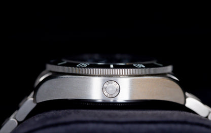 Tudor Pelagos dive watch showcasing the side profile and technical features including the crown and titanium bracelet.