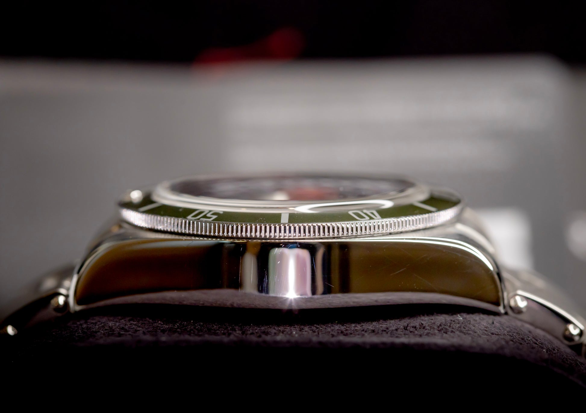 Tudor Black Bay Harrods Edition 41mm watch side view showcasing the green bezel and stainless steel case.