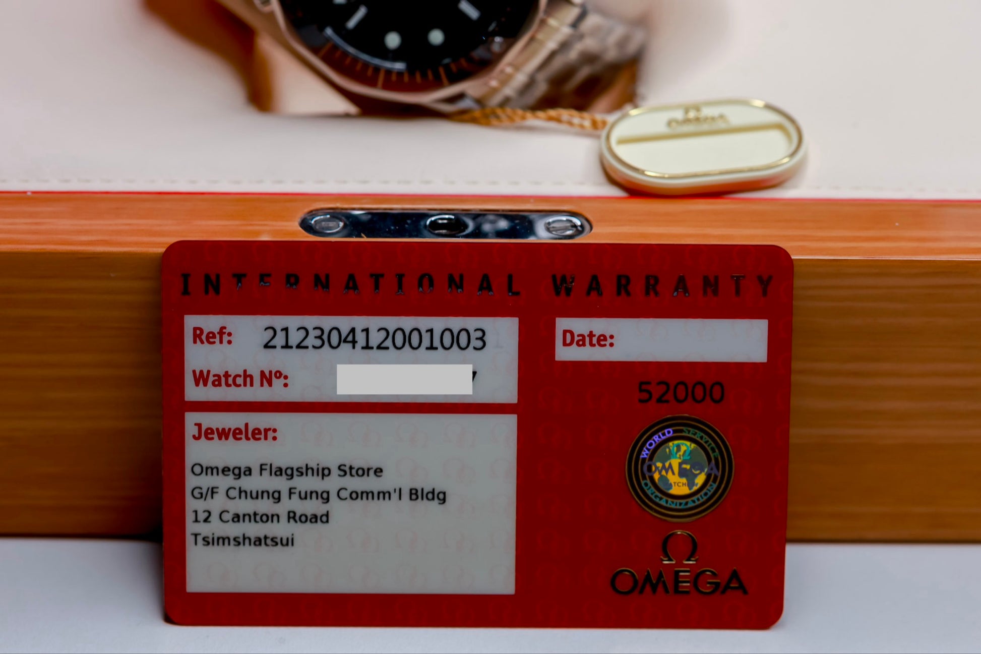 Omega Seamaster Diver original box papers warranty card showing details and authenticity of the watch.