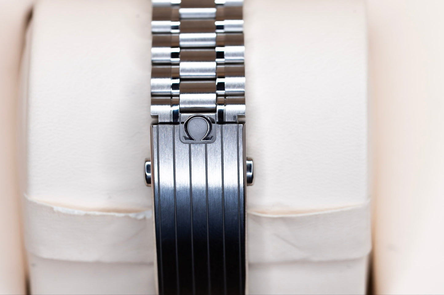 Omega Speedmaster Chronoscope stainless steel bracelet with logo detail.