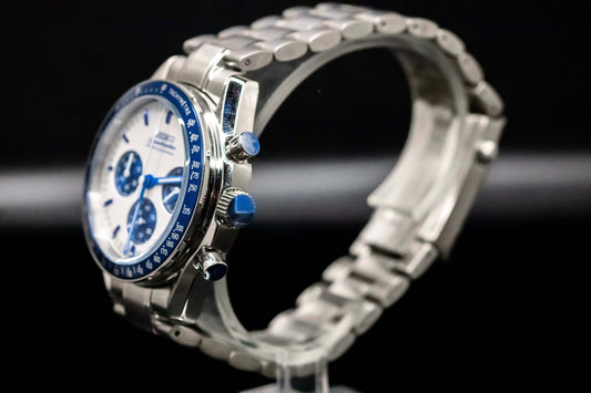 Seiko Speedmaster Snoopy watch featuring blue dial and stainless steel bracelet, showcasing elegance and precision.