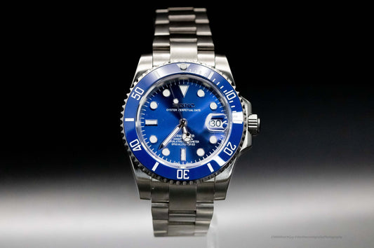 Seiko Mod Smurf Diver automatic watch with blue dial and ceramic bezel, showcasing a stainless steel bracelet.