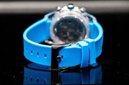 Close-up of the blue silicone strap on KWC Blue Ceramic Chronograph watch with stainless steel clasp.