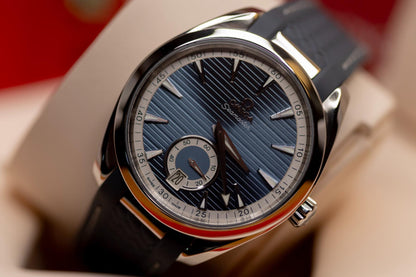 Omega Seamaster Aqua Terra 150M blue dial showcasing 41mm stainless steel watch with rubber strap and small seconds subdial.