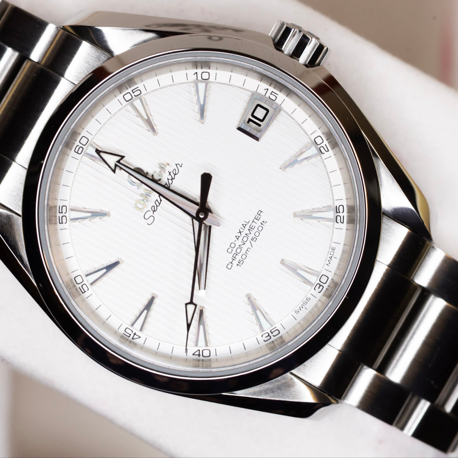 2016 Omega Seamaster Aqua Terra watch displaying a white lacquered dial and stainless steel bracelet.