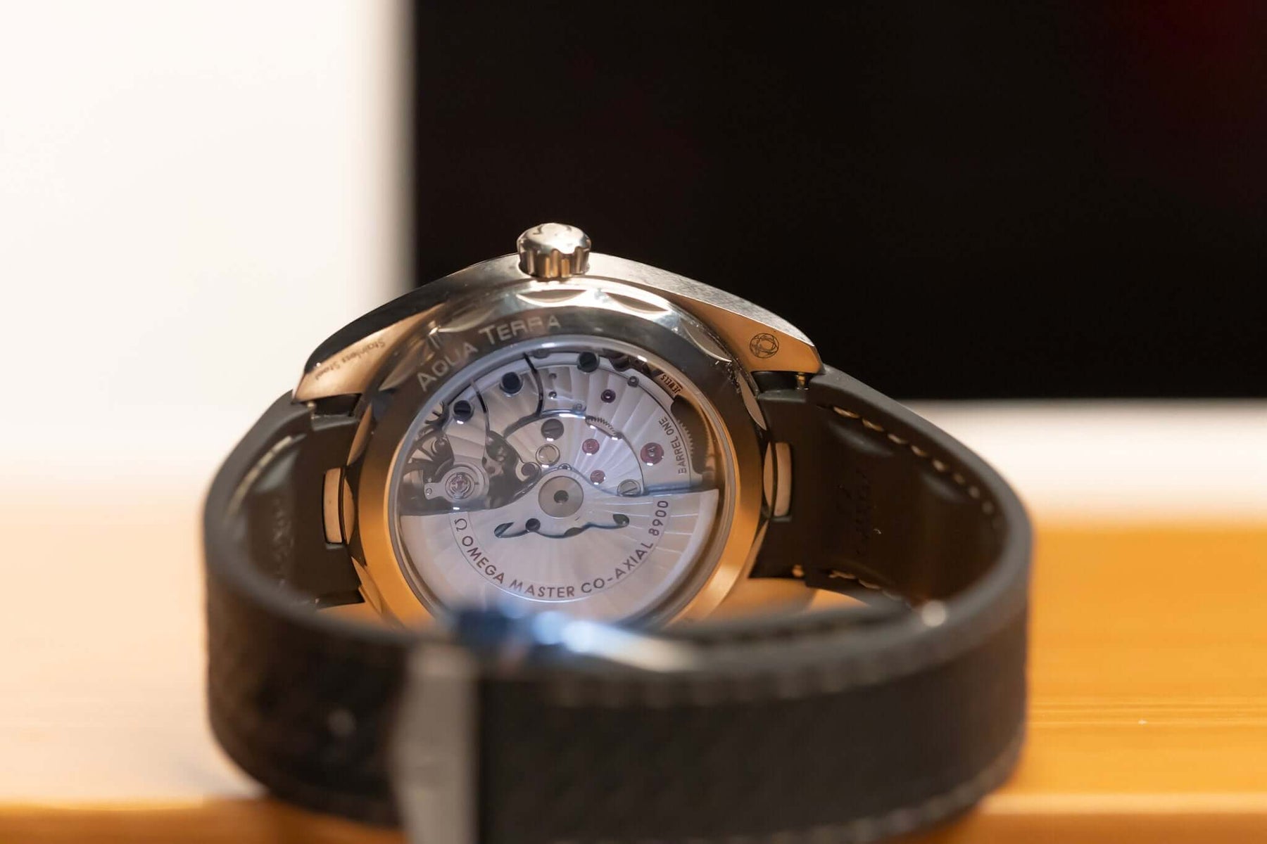 2022 Omega Seamaster Aqua Terra watch showing the intricate movement and black leather strap.