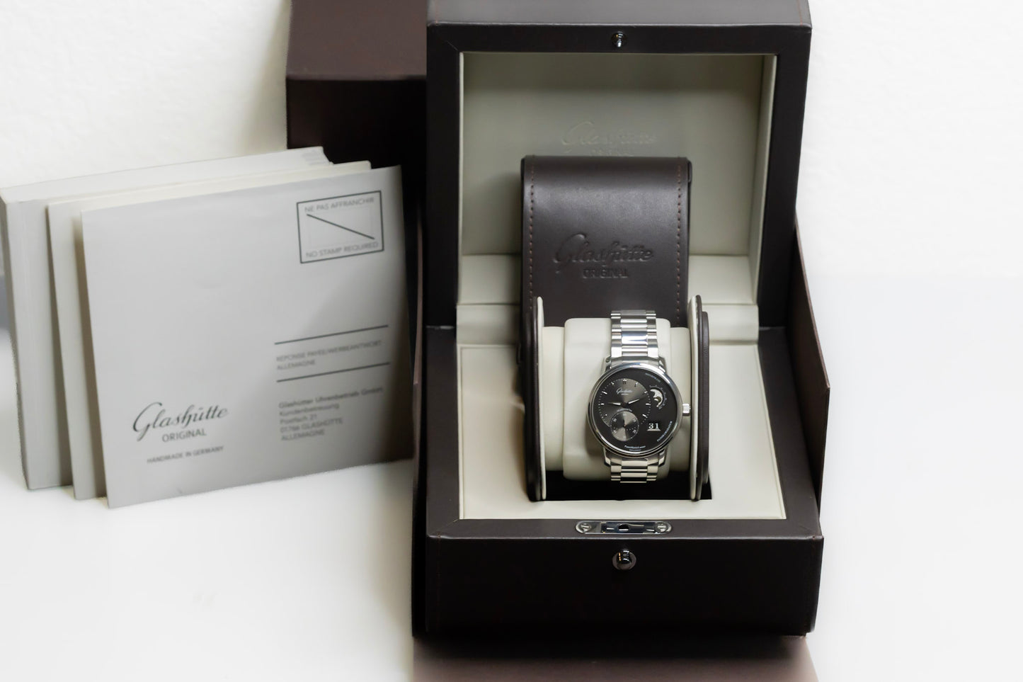 Glashütte Original PanoMaticLunar watch displayed in elegant box with instructions and warranty.