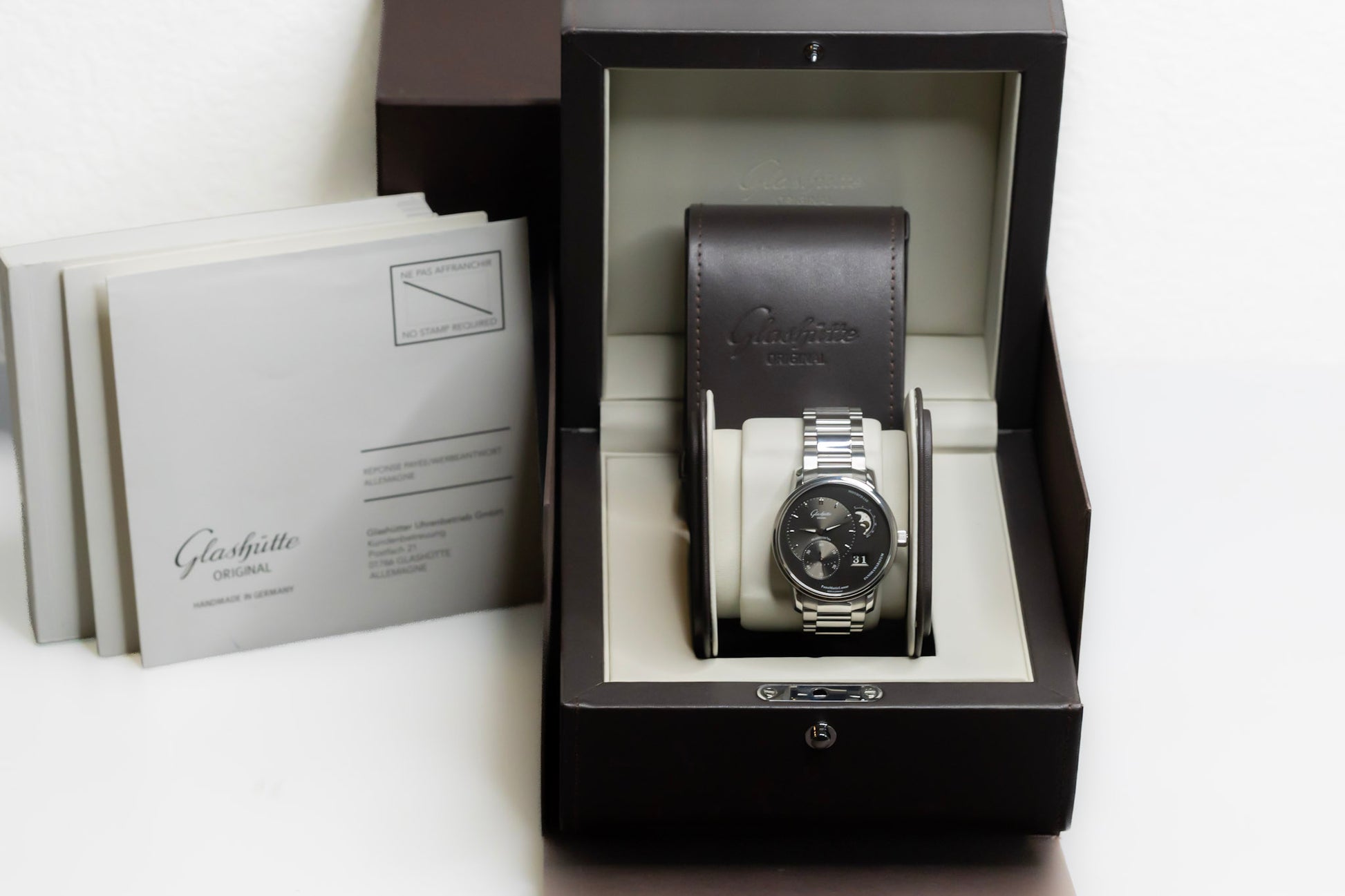 Glashütte Original PanoMaticLunar watch displayed in elegant box with instructions and warranty.