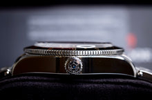 Tudor Black Bay GMT Coke watch side view showcasing the crown and bezel details.