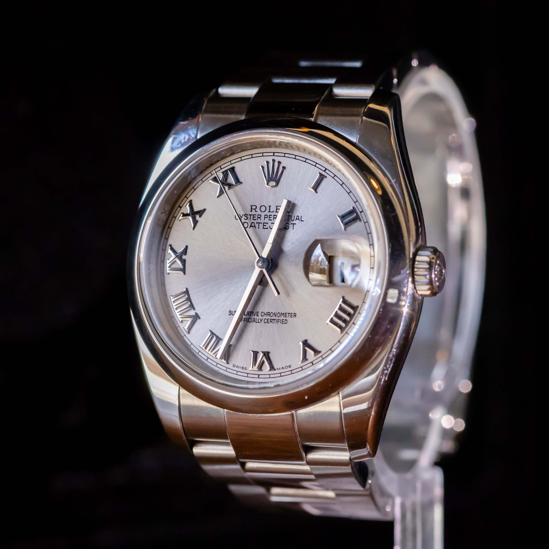 Rolex Datejust 36 full set on display with silver dial and Roman numerals, showcasing elegance and classic design.