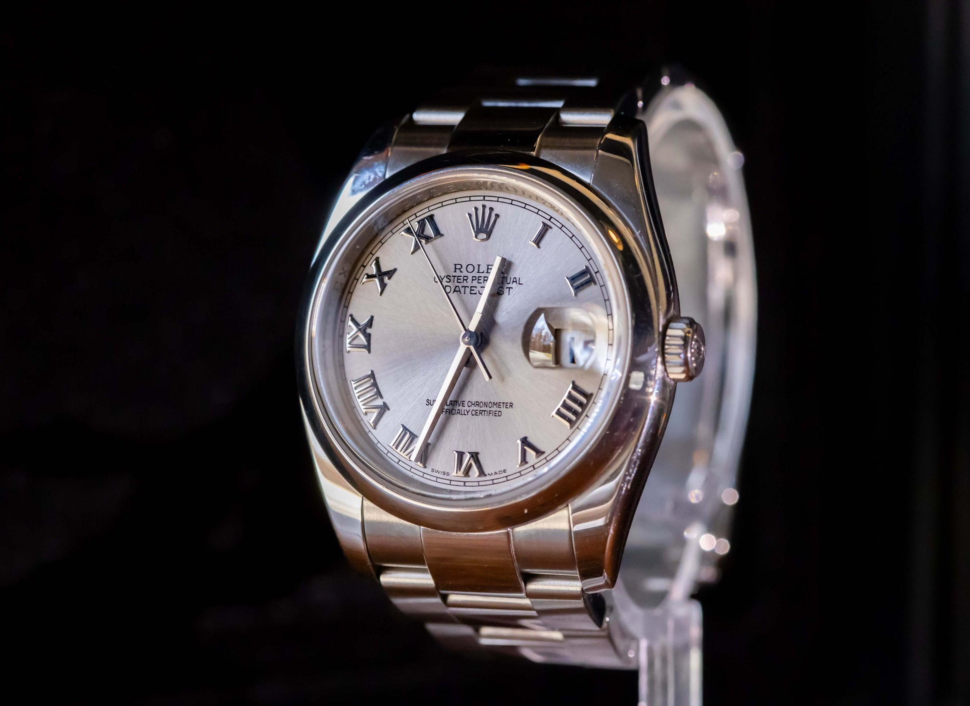 Rolex Datejust 36 full set on display with silver dial and Roman numerals, showcasing elegance and classic design.