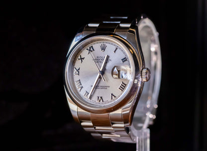 Rolex Datejust 36 full set on display with silver dial and Roman numerals, showcasing elegance and classic design.