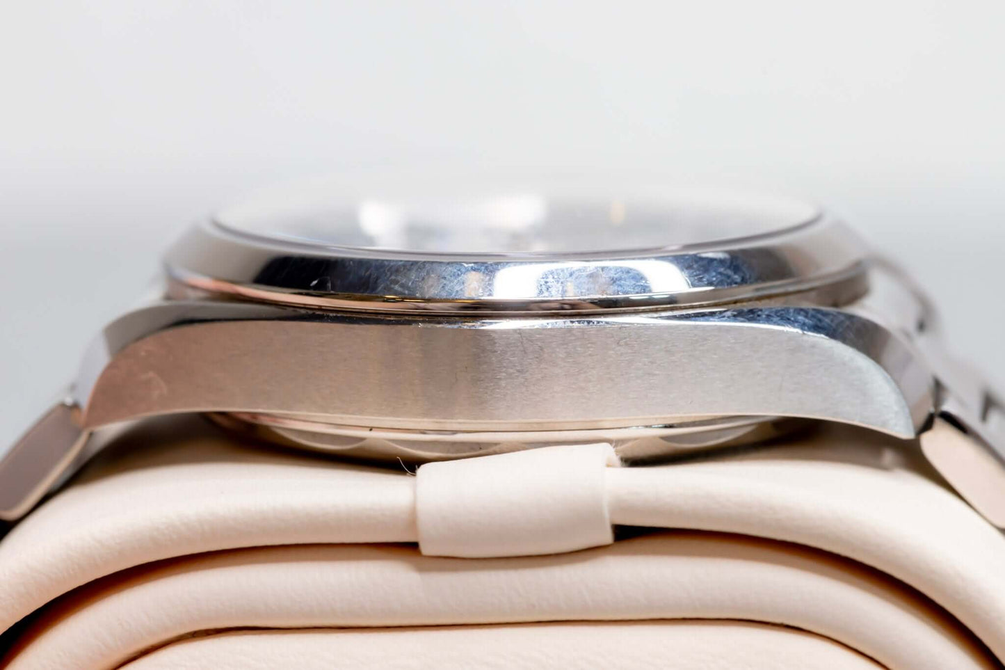 Omega Aqua Terra Small Seconds watch side view showcasing stainless steel case and polished finish.