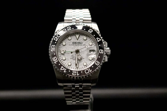 Seiko Bruce Wayne GMT watch with meteorite dial and black ceramic bezel, designed by Kingdom Watch Company.
