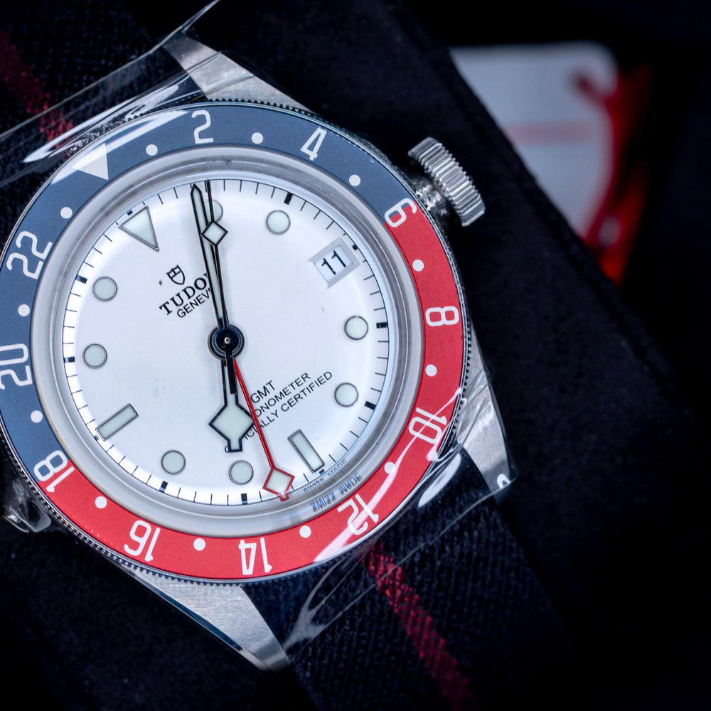 Tudor Black Bay GMT Pepsi watch featuring an opaline dial and a burgundy-and-blue bezel