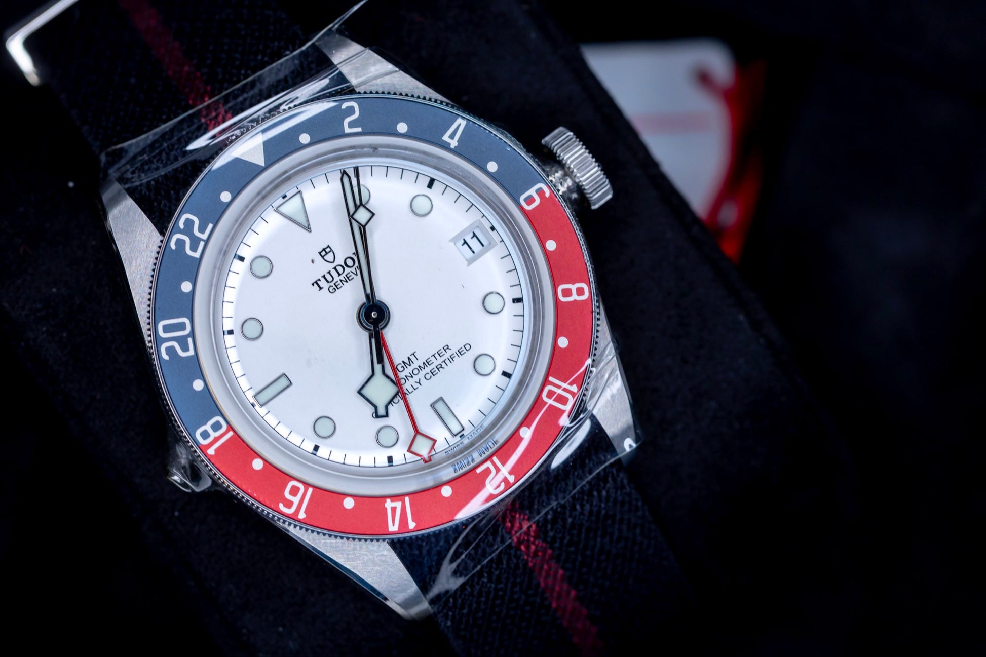 Tudor Black Bay GMT Pepsi watch featuring an opaline dial and a burgundy-and-blue bezel