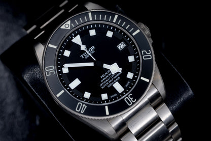 Tudor Pelagos dive watch showcasing Grade 2 titanium and iconic snowflake hands on a black background.