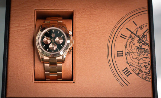Kingdom 7750 Automatic Chronograph in rose gold, displayed in luxurious leather box with intricate clock design.