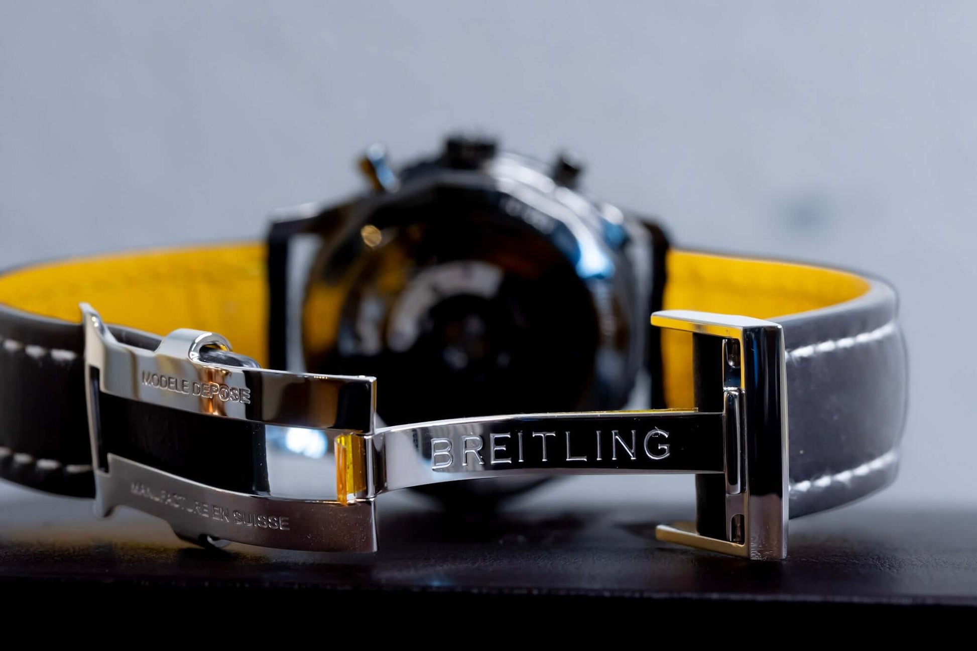 Breitling Navitimer 01 Stratus Gray limited edition watch strap with yellow lining and silver clasp.