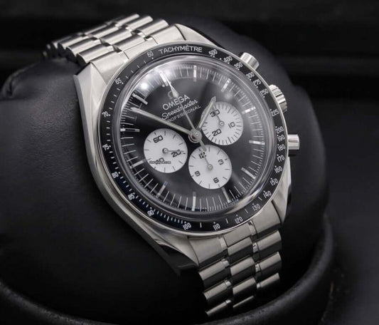 2026 Reverse Panda Omega Speedmaster Professional Moonwatch on black background with stainless steel bracelet.