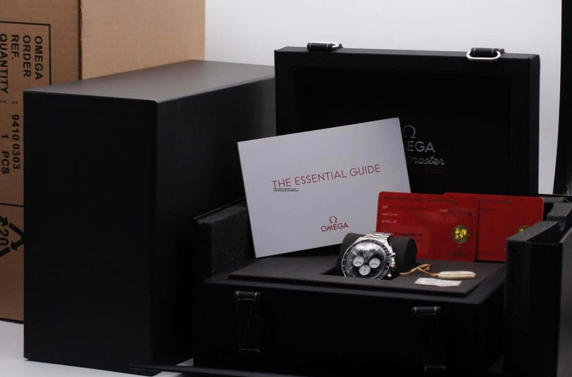 2026 Reverse Panda Omega Speedmaster Professional Moonwatch displayed in black packaging with essential guide and warranty cards.