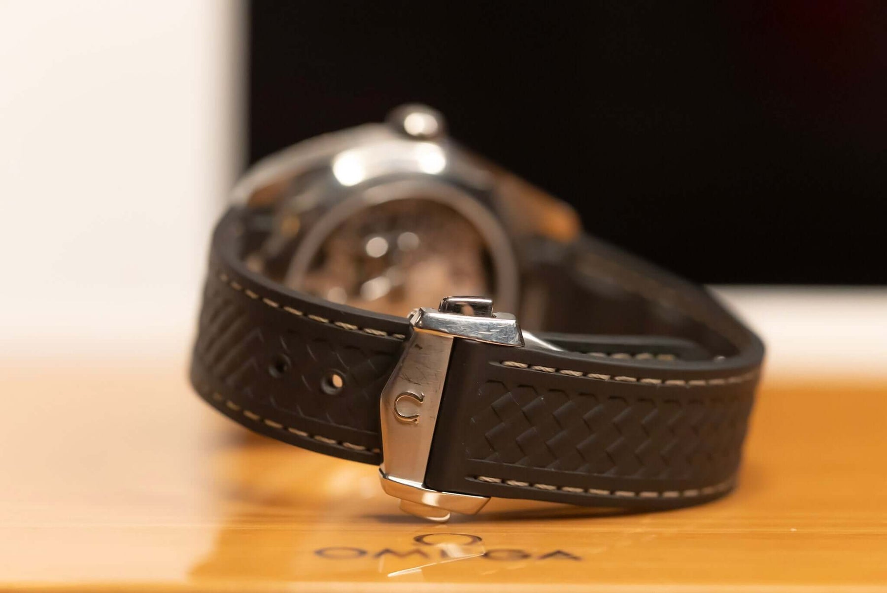 2022 Omega Seamaster Aqua Terra watch with a black rubber strap showcasing its elegant design and Omega branding.
