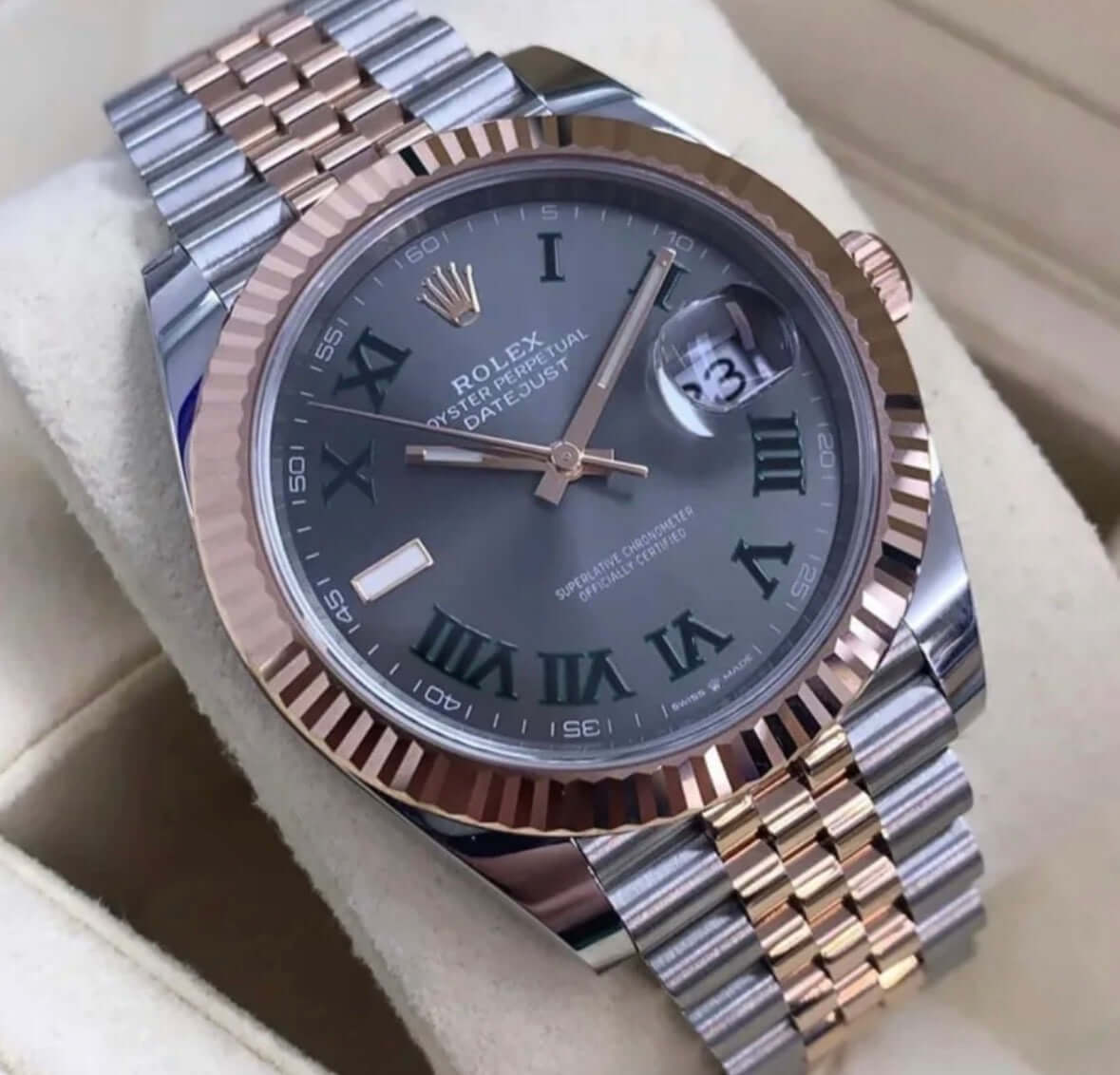 Rolex Datejust 41 Wimbledon 126331 Two Tone Everose Pink Gold watch on display with grey dial and Roman numerals.