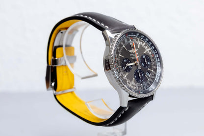 Breitling Navitimer 01 Stratus Gray limited edition watch side view with black leather strap and yellow lining.