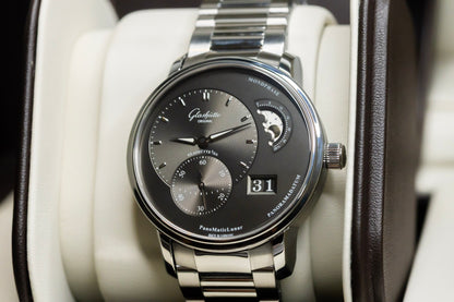 Glashütte Original PanoMaticLunar watch displayed in luxury case with stainless steel bracelet and moonphase feature.