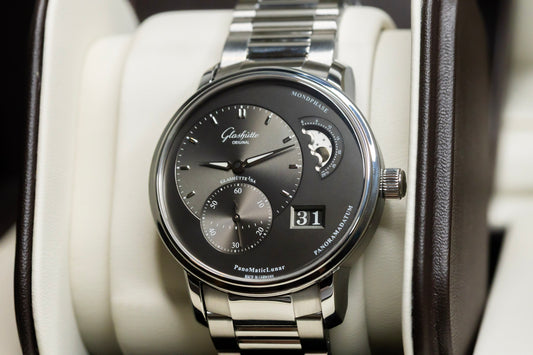 Glashütte Original PanoMaticLunar watch displayed in luxury case with stainless steel bracelet and moonphase feature.