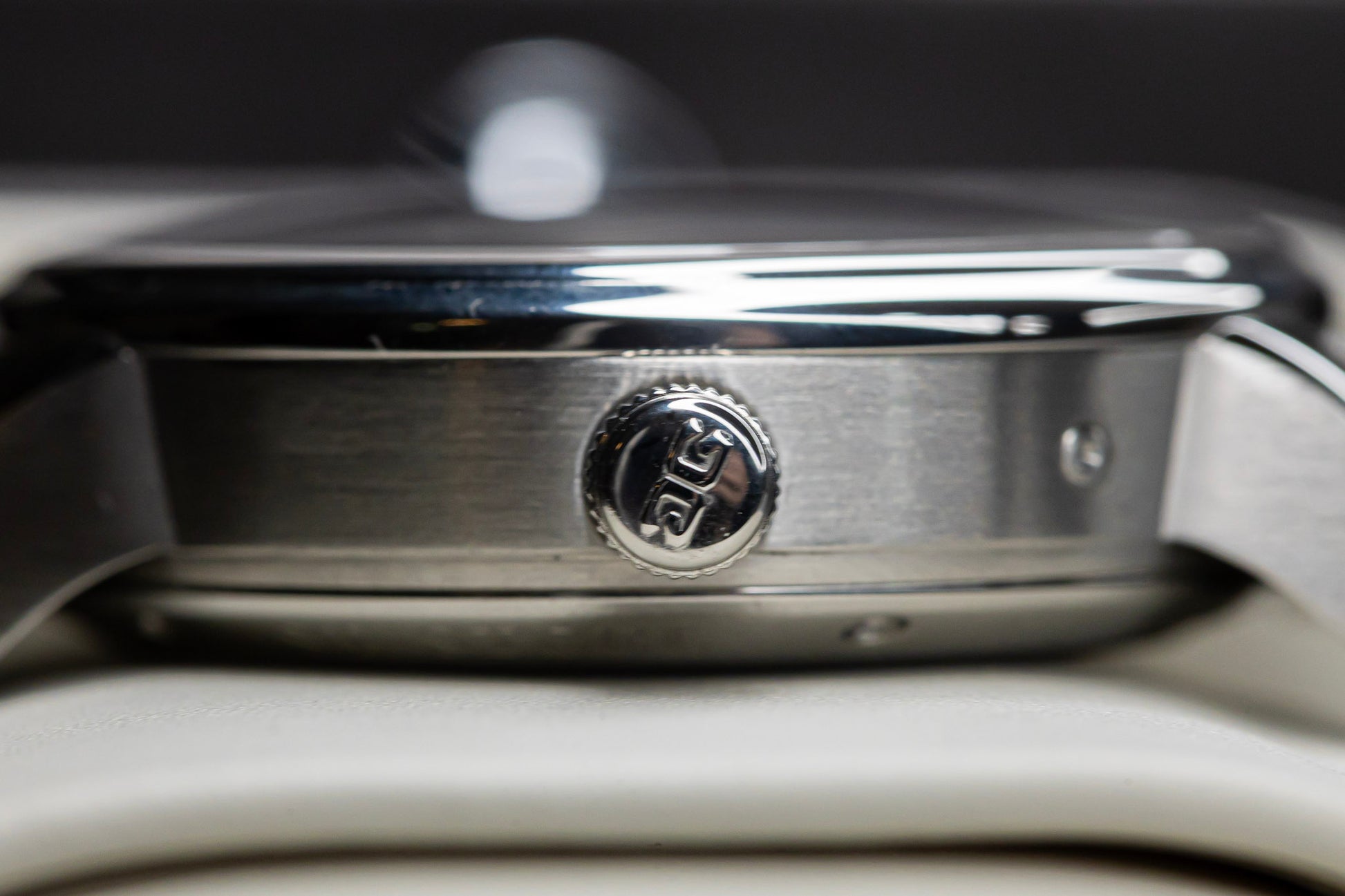 Side view of the Glashütte Original PanoMaticLunar watch showcasing the stainless steel case and crown.