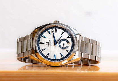 Omega Aqua Terra Small Seconds watch with silver teak-pattern dial and stainless steel bracelet.