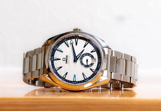 Omega Aqua Terra Small Seconds watch with silver teak-pattern dial and stainless steel bracelet.