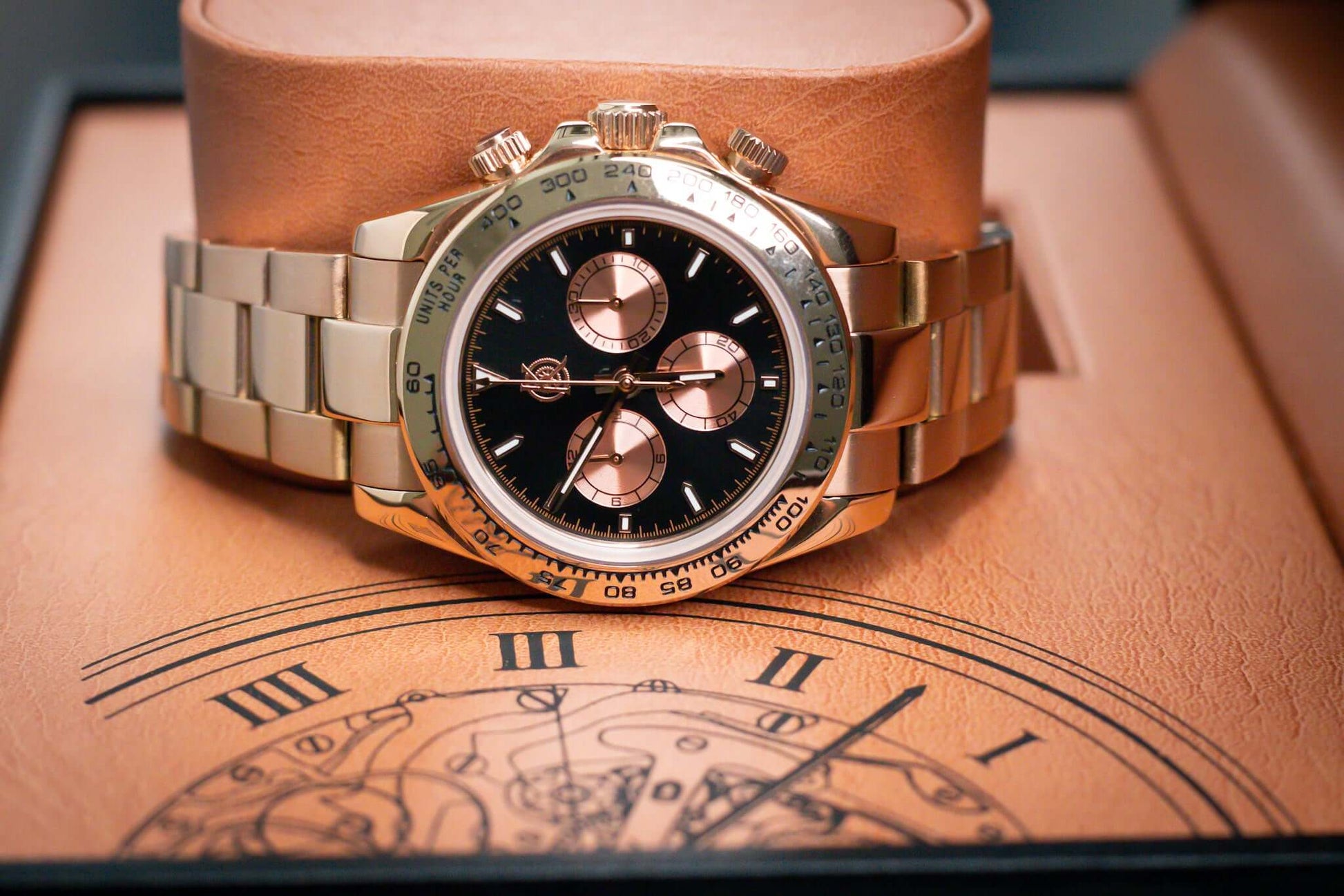 Kingdom 7750 Automatic Chronograph watch in rose gold with black face, on display in elegant presentation box.