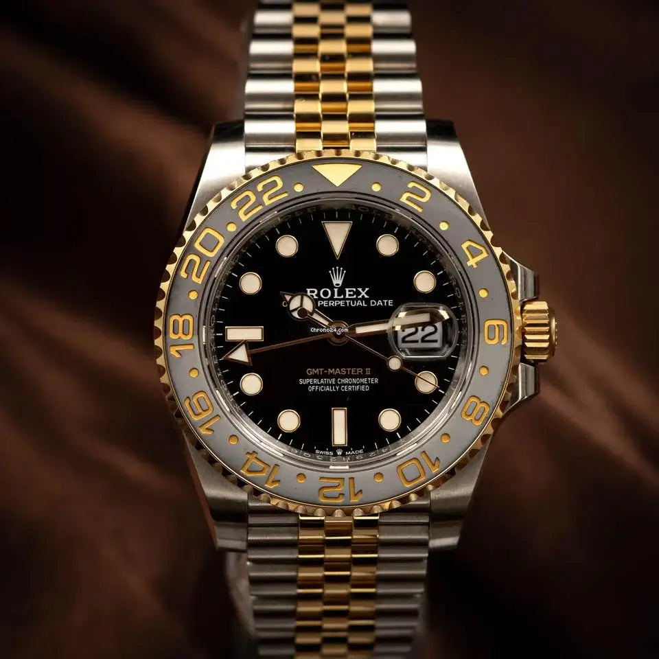 2024 Rolex GMT-Master II GRNR two-tone watch with black dial and Cerachrom bezel in Oystersteel and gold.