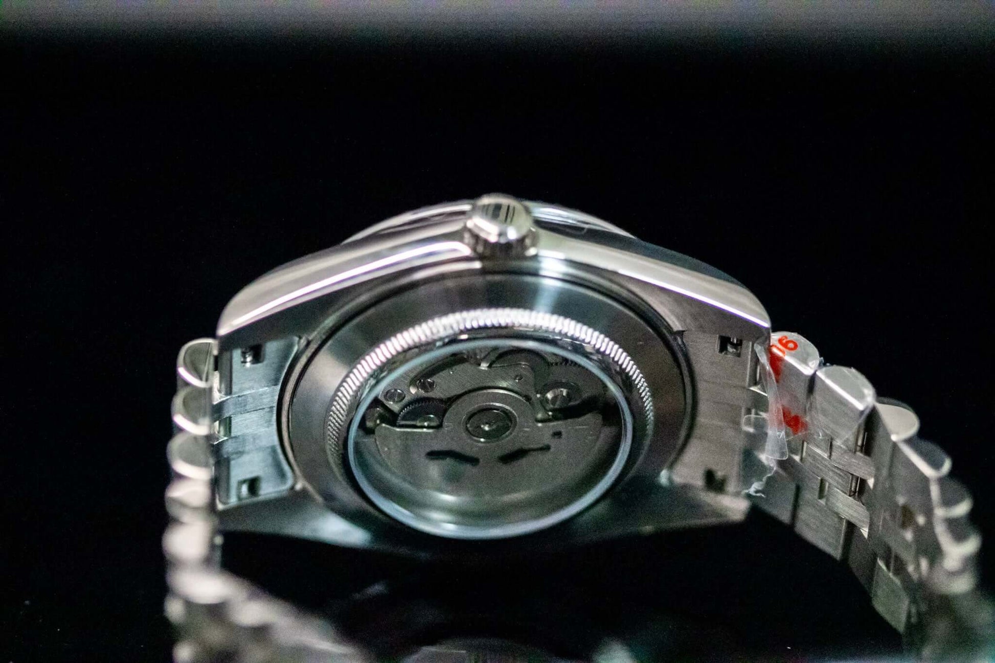 Back view of the blue SeikoMod Land Dweller watch showcasing its NH36 automatic movement and stainless steel strap.