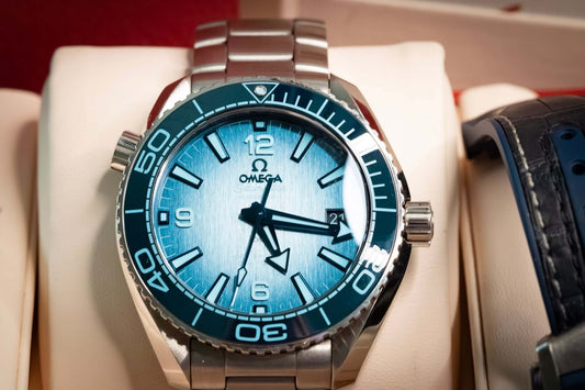 OMEGA Seamaster Planet Ocean 600M 39.5mm Blue Dial Ref. 215.30.40.20.03.002 – Full Set displayed on cushion