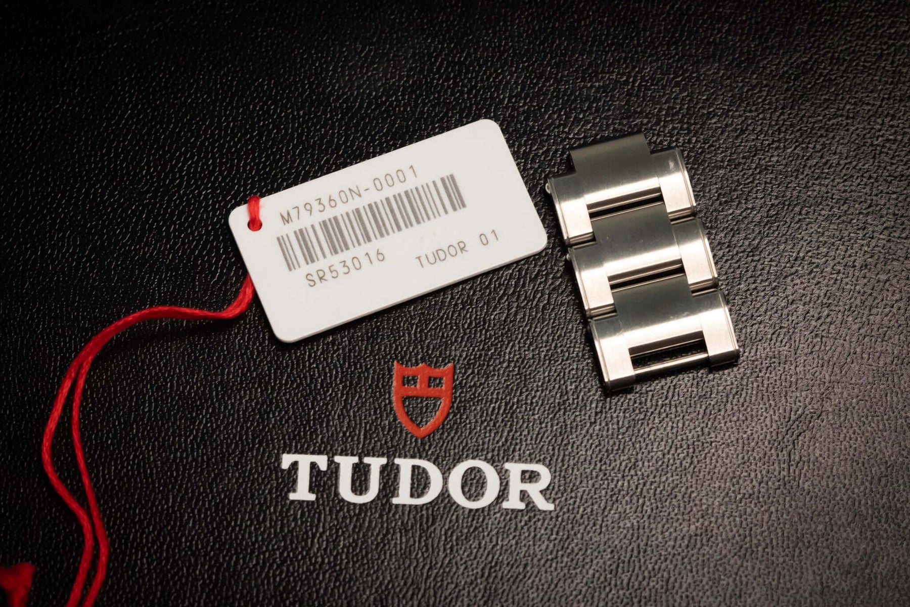 TUDOR Black Bay Chronograph – Reverse Panda Dial – Ref. 79360N – Full Set, watch tag and bracelet on display.