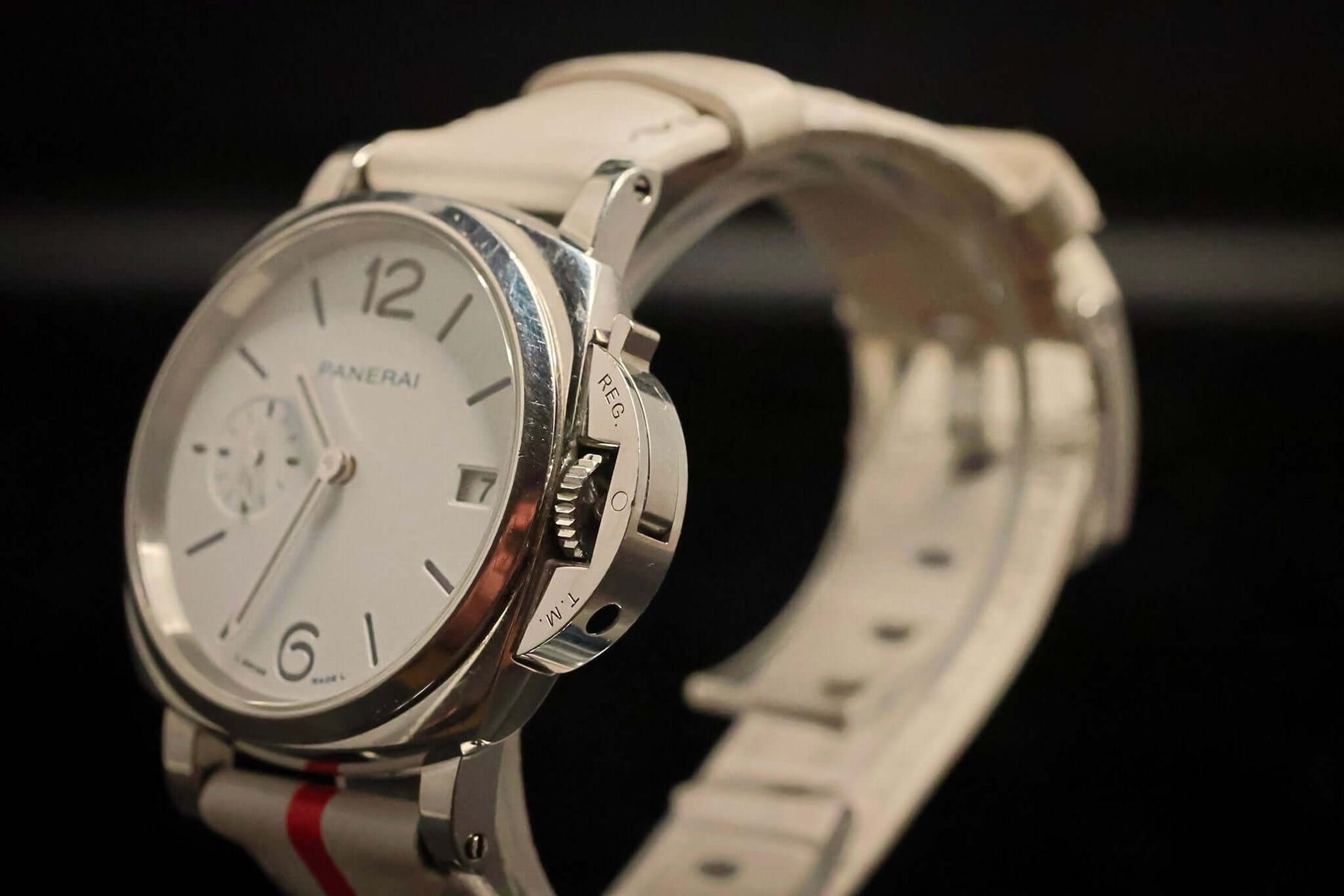 Panerai Luminor Submersible Luna Rossa PAM01306 – 38MM Stainless Steel Men’s Watch – Full Set side view on white strap.