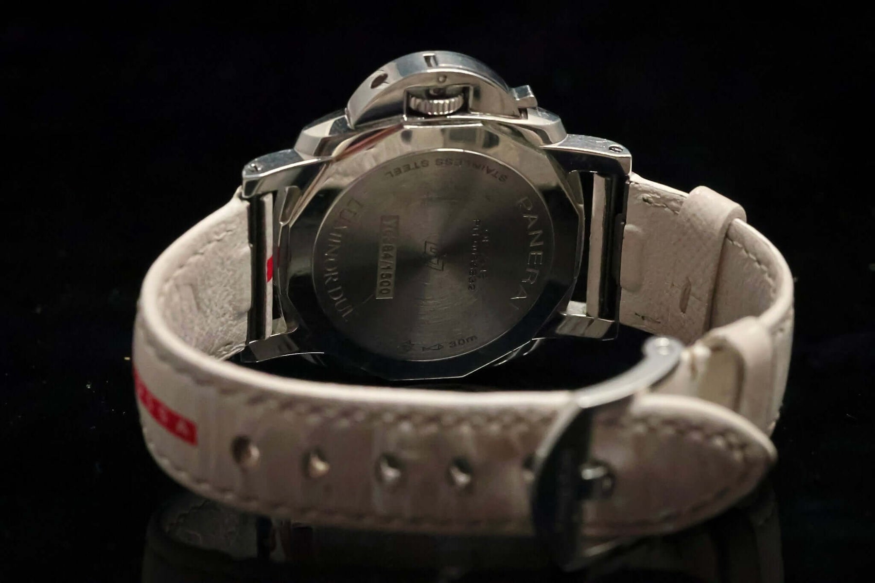 Back view of Panerai Luminor Submersible Luna Rossa PAM01306 – 38MM Stainless Steel Men’s Watch – Full Set with white strap.