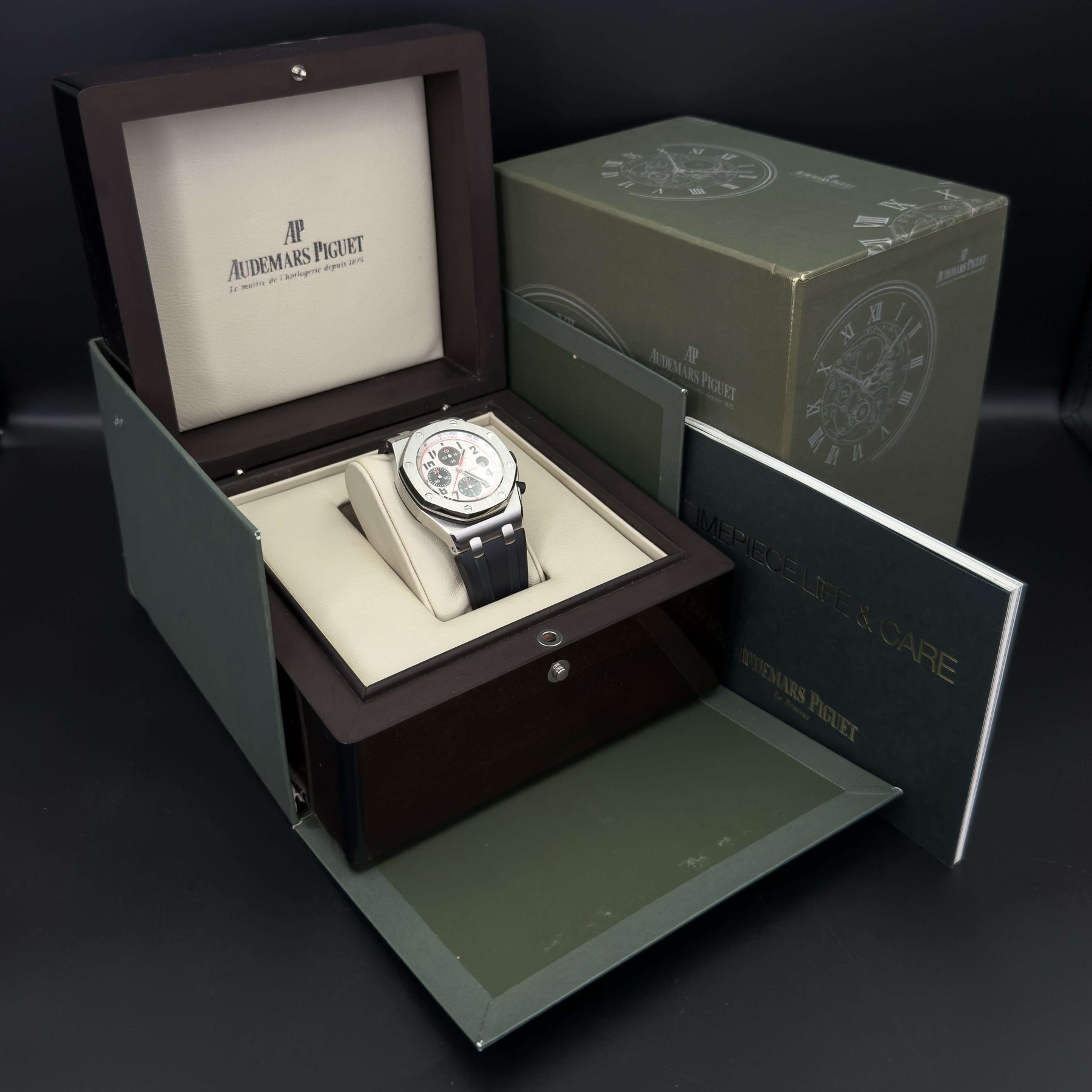 Audemars Piguet Royal Oak Offshore men's watch displayed in luxury box with packaging and manuals.