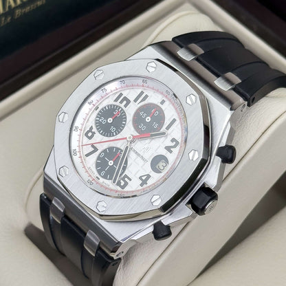 Audemars Piguet Royal Oak Offshore men's watch featuring a white hobnail dial and red chronograph accents on a black rubber strap.