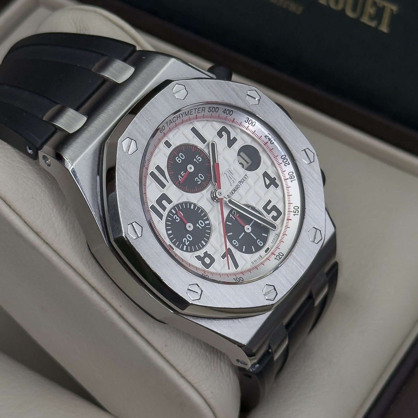 Audemars Piguet Royal Oak Offshore men's watch showcasing its white hobnail dial and black rubber strap.