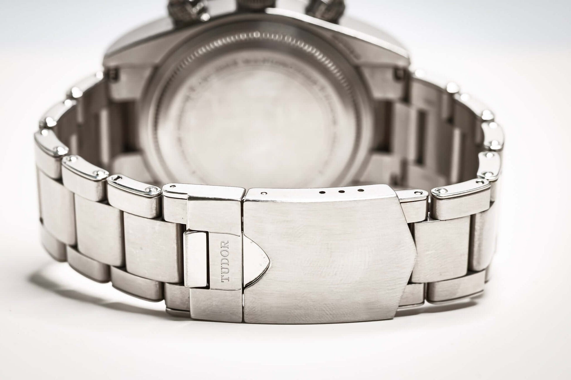 Tudor Black Bay Chronograph Panda watch showing stainless steel bracelet and case back design.