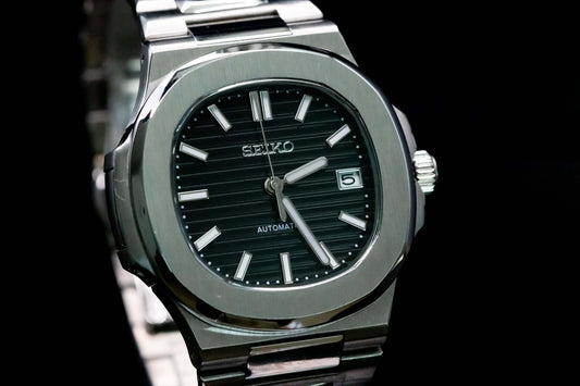 Close-up of midnight black dial on SeikoMod Silver Nautilus watch