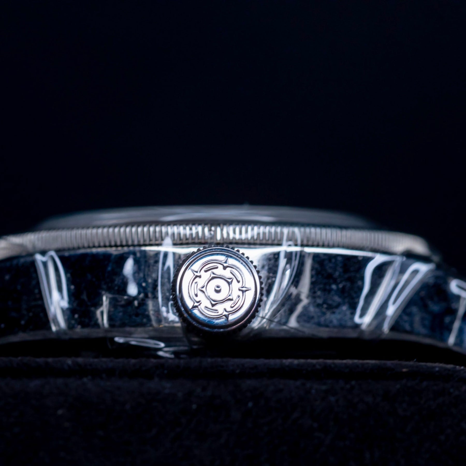 Tudor Black Bay GMT Pepsi watch side view with polished case and winding crown detail.